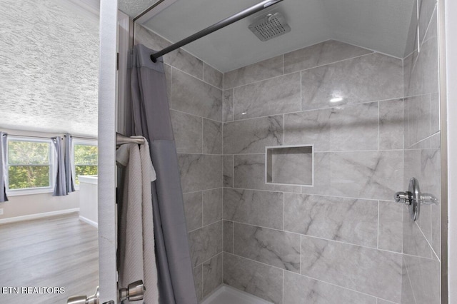 2270 Cove Pointe Rd, Lafollette, TN 37766 - bathroom with tiled shower and wood finished floors