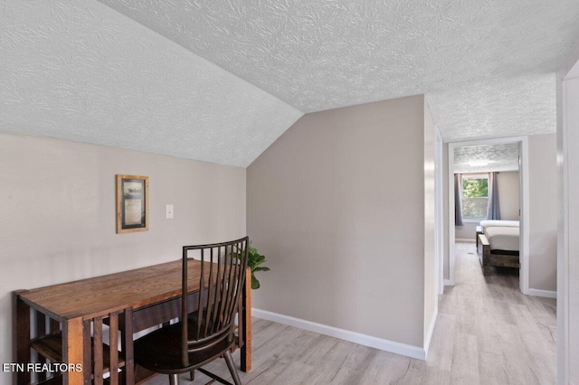 2270 Cove Pointe Rd, Lafollette, TN 37766 - dining room featuring a textured ceiling, light wood finished floors, and vaulted ceiling