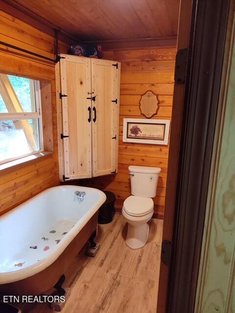 419 River Rd, Huntsville, TN 37756 - full bathroom featuring wooden walls, a freestanding tub, wood finished floors, and wooden ceiling
