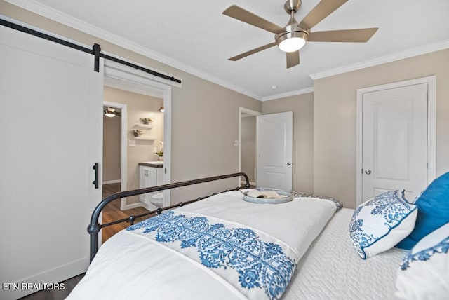 750 Everett Rd, Farragut, TN 37934 - bedroom featuring a barn door, wood finished floors, ornamental molding, a ceiling fan, and ensuite bath