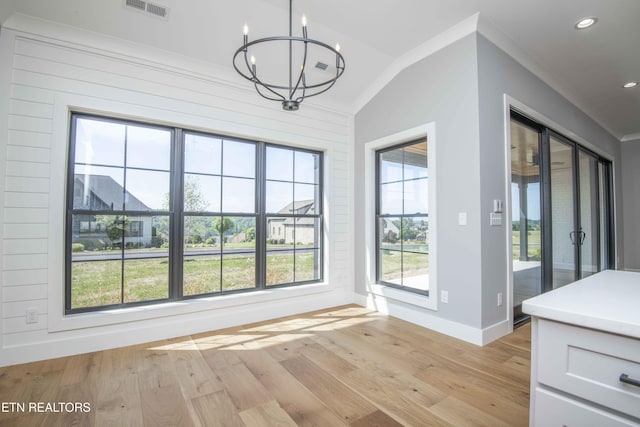 256 Watercrest Dr, Vonore, TN 37885 - unfurnished dining area with a chandelier, light wood-type flooring, crown molding, recessed lighting, and lofted ceiling