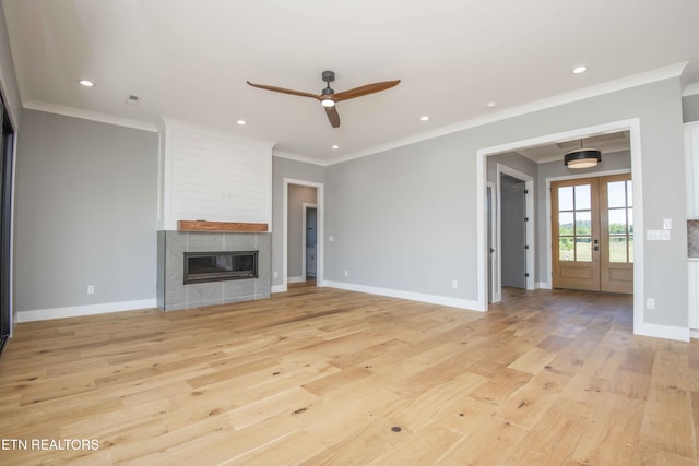 256 Watercrest Dr, Vonore, TN 37885 - unfurnished living room featuring ceiling fan, light wood finished floors, a fireplace, recessed lighting, and french doors
