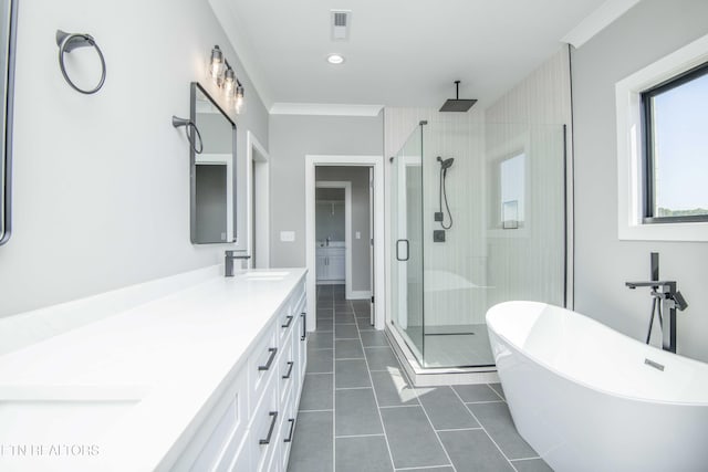 256 Watercrest Dr, Vonore, TN 37885 - bathroom with a shower stall, tile patterned floors, double vanity, a freestanding bath, and crown molding