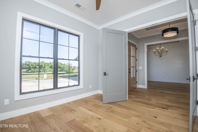 256 Watercrest Dr, Vonore, TN 37885 - empty room with a chandelier, light wood-style floors, and ceiling fan