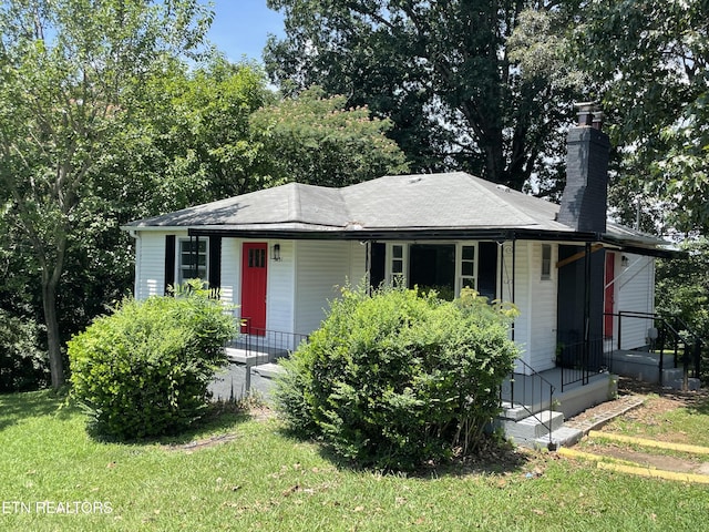 3431 Skyline Dr, Knoxville, TN 37914 - view of front of home featuring a porch, a chimney, and a front yard