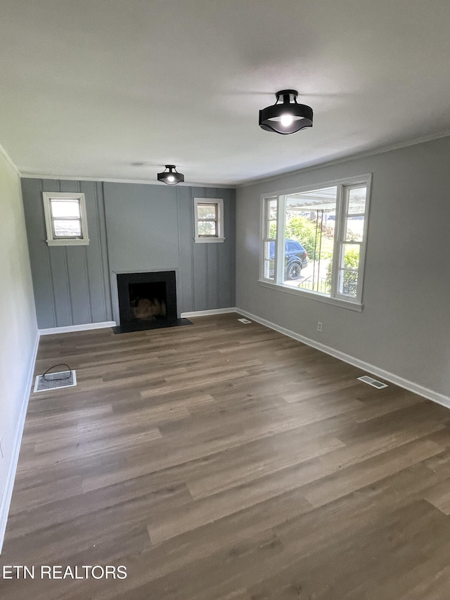 3431 Skyline Dr, Knoxville, TN 37914 - unfurnished living room with a fireplace with flush hearth, ornamental molding, and wood finished floors
