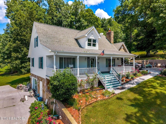 133 Rolling Hls, Rutledge, TN 37861 - view of front of home with a chimney, a garage, a porch, and a front yard