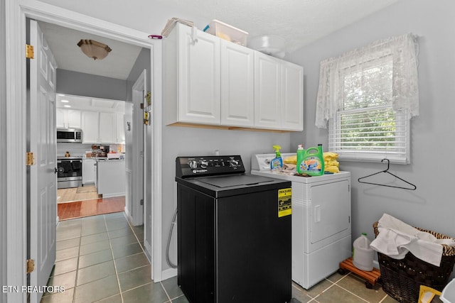133 Rolling Hls, Rutledge, TN 37861 - washroom featuring washing machine and clothes dryer, dark tile patterned floors, and cabinet space