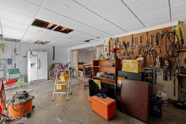 133 Rolling Hls, Rutledge, TN 37861 - below grade area featuring white fridge with ice dispenser and a paneled ceiling