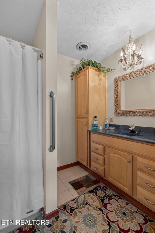 133 Rolling Hls, Rutledge, TN 37861 - full bath with vanity, a chandelier, tile patterned floors, curtained shower, and a textured ceiling