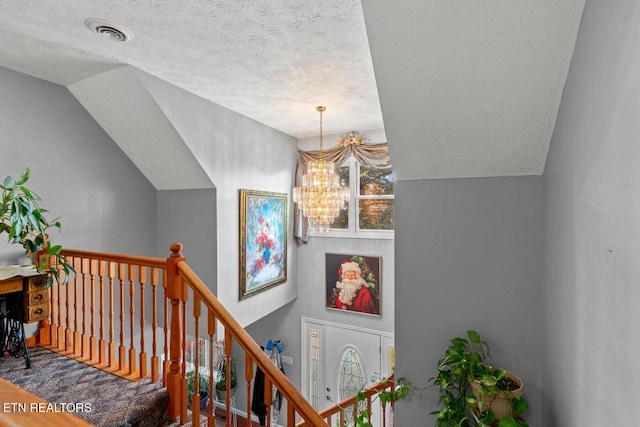 133 Rolling Hls, Rutledge, TN 37861 - staircase with a chandelier, a textured ceiling, and vaulted ceiling