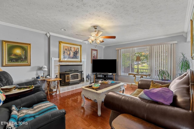 133 Rolling Hls, Rutledge, TN 37861 - living area featuring wood finished floors, a ceiling fan, ornamental molding, a textured ceiling, and a wood stove