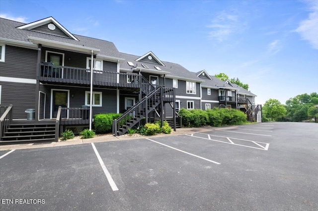 700 Shanghai Landing Ln Unit 11, Lafollette, TN 37766 - view of building exterior with stairway and uncovered parking