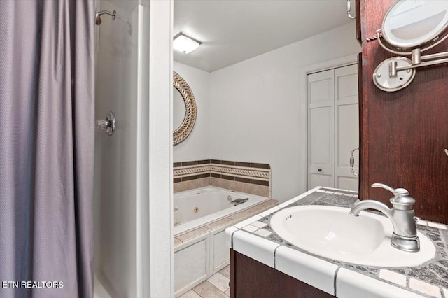 700 Shanghai Landing Ln Unit 11, Lafollette, TN 37766 - bathroom with a tub with jets, vanity, tile patterned floors, and curtained shower