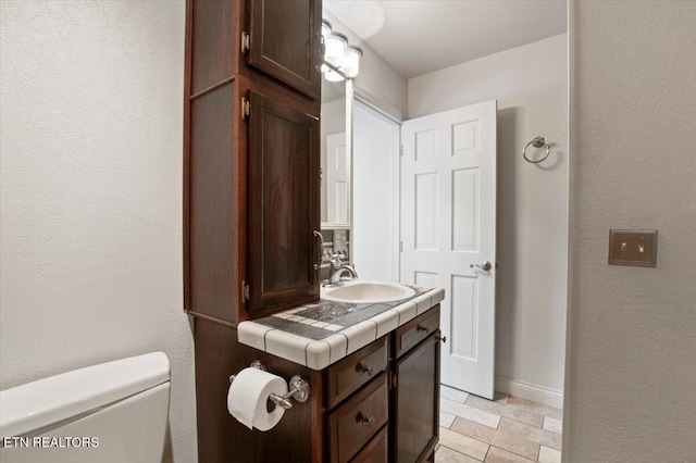 700 Shanghai Landing Ln Unit 11, Lafollette, TN 37766 - bathroom with vanity and a textured wall