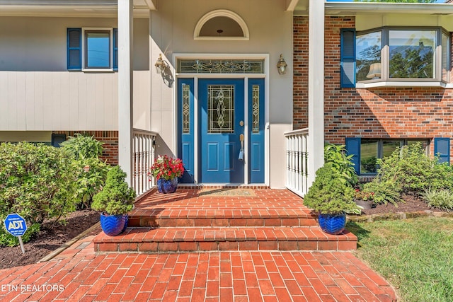 127 Newhaven Rd, Oak Ridge, TN 37830 - entrance to property featuring brick siding, covered porch, and stucco siding