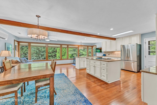 127 Newhaven Rd, Oak Ridge, TN 37830 - dining area with beam ceiling, light wood-style floors, a chandelier, recessed lighting, and a wall mounted AC