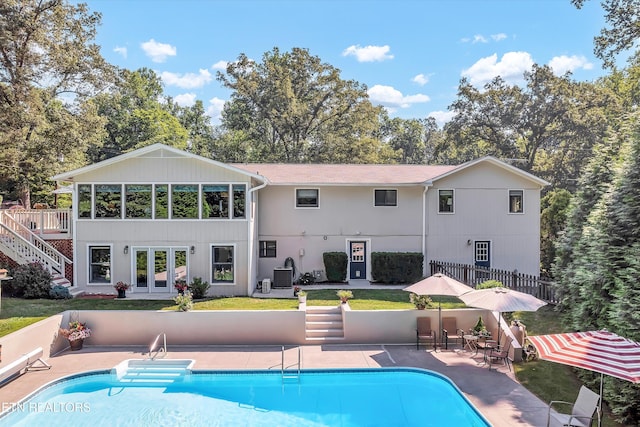 127 Newhaven Rd, Oak Ridge, TN 37830 - rear view of property with french doors, a patio area, and an outdoor pool