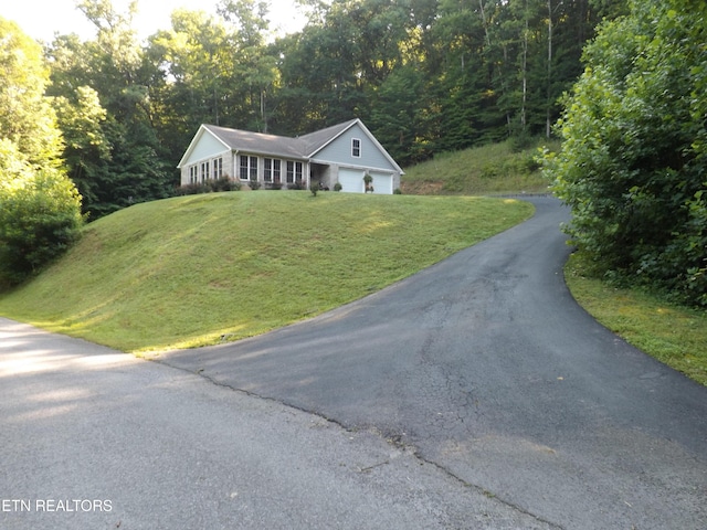 440 Sams Mtn, Middlesboro, KY 40965 - ranch-style house with asphalt driveway, a front yard, and a view of trees