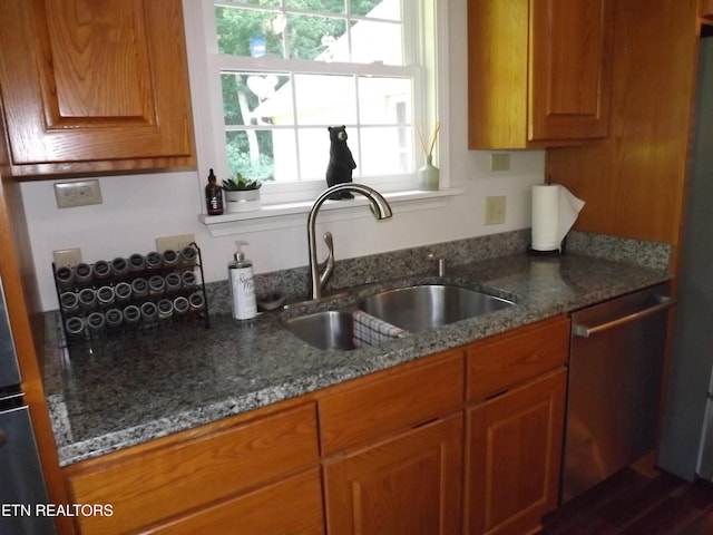 440 Sams Mtn, Middlesboro, KY 40965 - kitchen featuring dishwasher, brown cabinets, and dark stone countertops