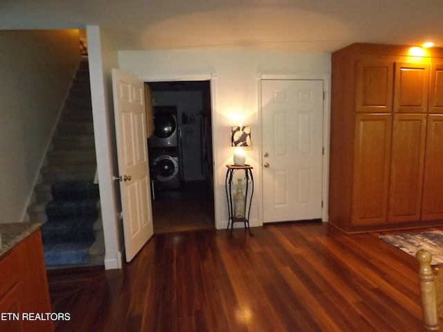 440 Sams Mtn, Middlesboro, KY 40965 - interior space featuring stacked washer and clothes dryer and dark wood-style flooring