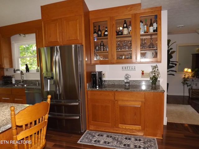 440 Sams Mtn, Middlesboro, KY 40965 - kitchen featuring stainless steel fridge with ice dispenser, dishwasher, brown cabinets, and stone counters