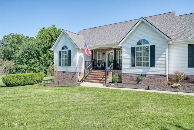 1036 Circle Dr, Jamestown, TN 38556 - view of front of home with covered porch, roof with shingles, a front lawn, and crawl space