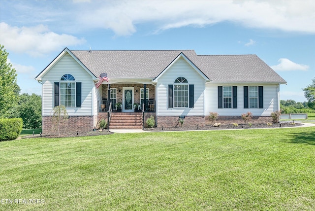 1036 Circle Dr, Jamestown, TN 38556 - ranch-style home with a porch, a front lawn, roof with shingles, and brick siding