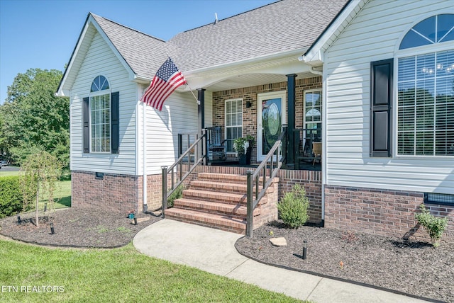 1036 Circle Dr, Jamestown, TN 38556 - property entrance with a shingled roof, a porch, and brick siding