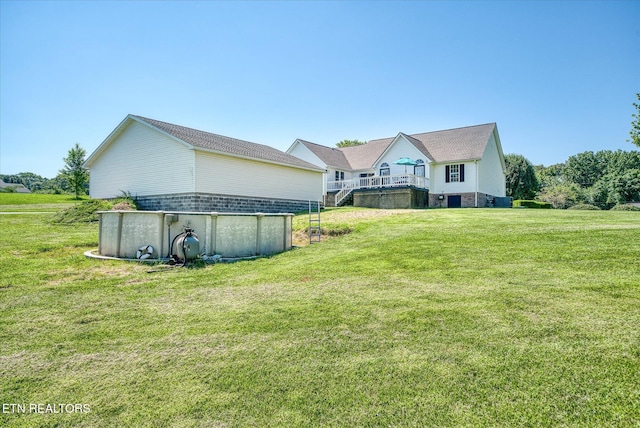 1036 Circle Dr, Jamestown, TN 38556 - back of house with a lawn, an outdoor pool, and a deck