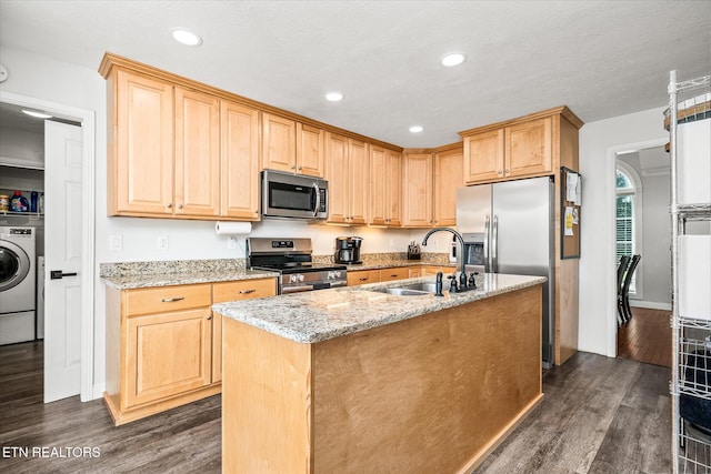 1036 Circle Dr, Jamestown, TN 38556 - kitchen featuring appliances with stainless steel finishes, dark wood-style floors, washer / dryer, light brown cabinets, and light stone counters