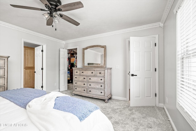 1036 Circle Dr, Jamestown, TN 38556 - bedroom with light colored carpet, ornamental molding, a walk in closet, a closet, and a ceiling fan