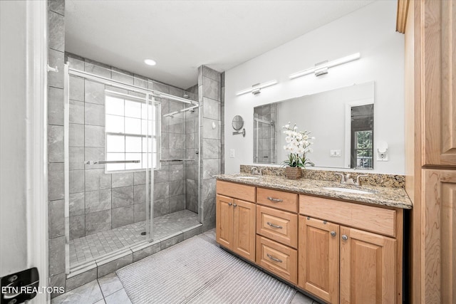 1036 Circle Dr, Jamestown, TN 38556 - full bathroom featuring tile patterned floors, a shower stall, and double vanity