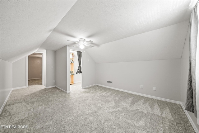 1036 Circle Dr, Jamestown, TN 38556 - bonus room with carpet, a textured ceiling, lofted ceiling, and ceiling fan