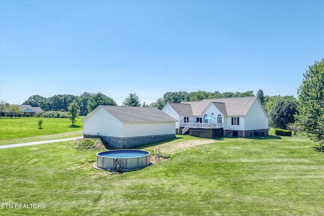 1036 Circle Dr, Jamestown, TN 38556 - view of side of home with a pool, a yard, and a wooden deck