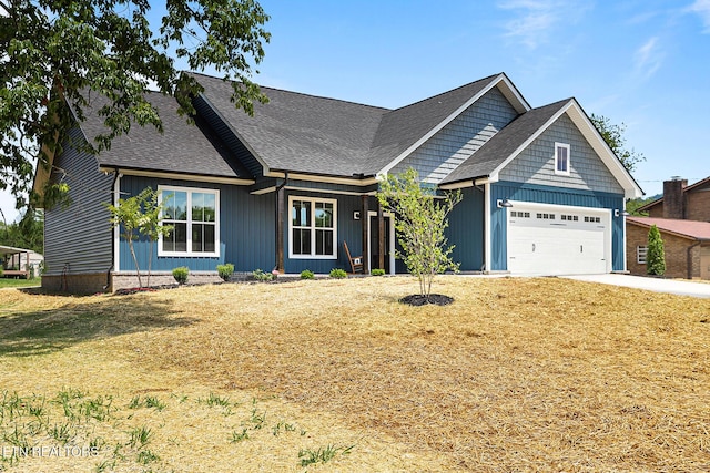 7245 Deville Way, Powell, TN 37849 - view of front of home with a garage, a shingled roof, driveway, a front yard, and board and batten siding