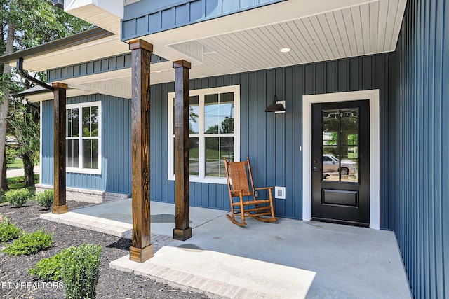 7245 Deville Way, Powell, TN 37849 - doorway to property with a porch and board and batten siding