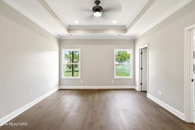 7245 Deville Way, Powell, TN 37849 - spare room featuring plenty of natural light, ceiling fan, dark wood finished floors, a tray ceiling, and ornamental molding