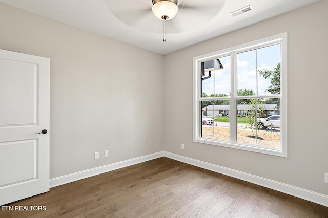 7245 Deville Way, Powell, TN 37849 - unfurnished room with healthy amount of natural light, dark wood-style floors, and ceiling fan
