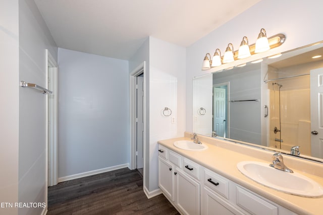 1032 Willow Creek Cir, Maryville, TN 37804 - full bathroom with double vanity, wood finished floors, and a shower
