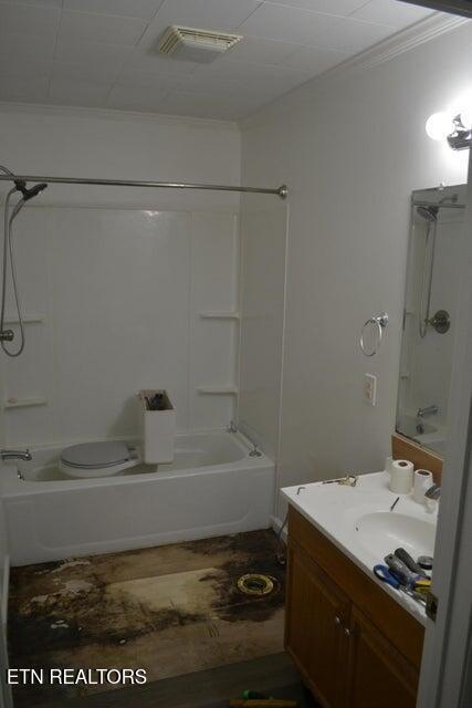 31058 US-127, Pikeville, TN 37367 - bathroom featuring ornamental molding, shower / bath combination, and vanity