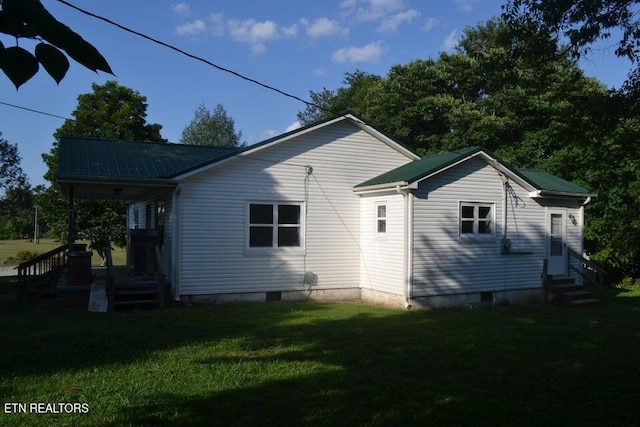31058 US-127, Pikeville, TN 37367 - back of property with entry steps, a lawn, and a metal roof