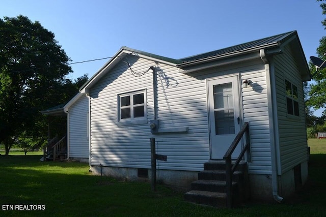 31058 US-127, Pikeville, TN 37367 - view of property exterior featuring entry steps, a yard, and a metal roof
