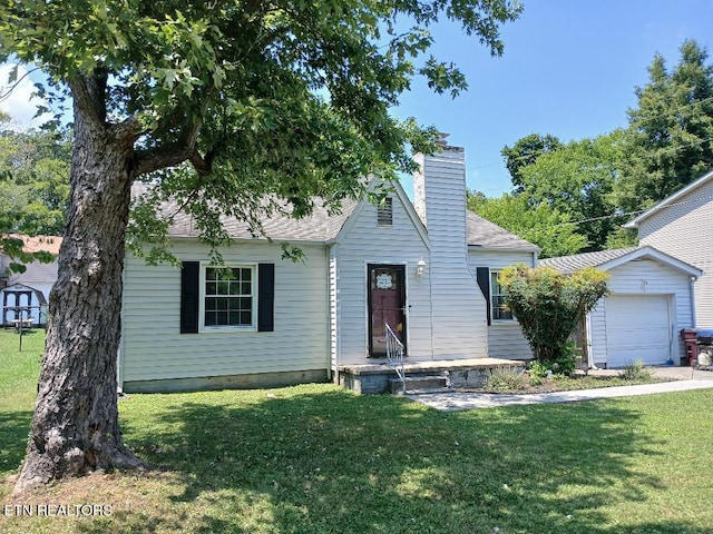 955 Poplar St, Alcoa, TN 37701 - view of front of home with a chimney, a front lawn, and an attached garage