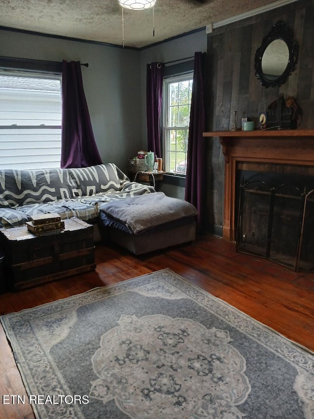 955 Poplar St, Alcoa, TN 37701 - living room with wood finished floors, a textured ceiling, and a fireplace