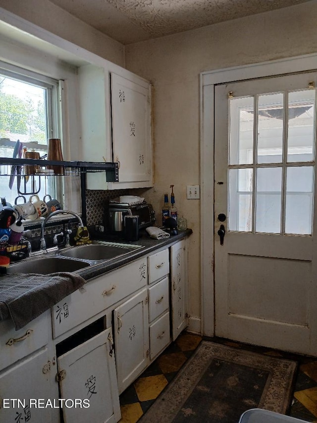 955 Poplar St, Alcoa, TN 37701 - kitchen with white cabinetry and dark countertops