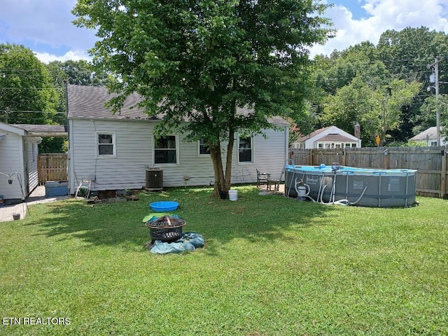955 Poplar St, Alcoa, TN 37701 - rear view of property with a fire pit and a fenced backyard