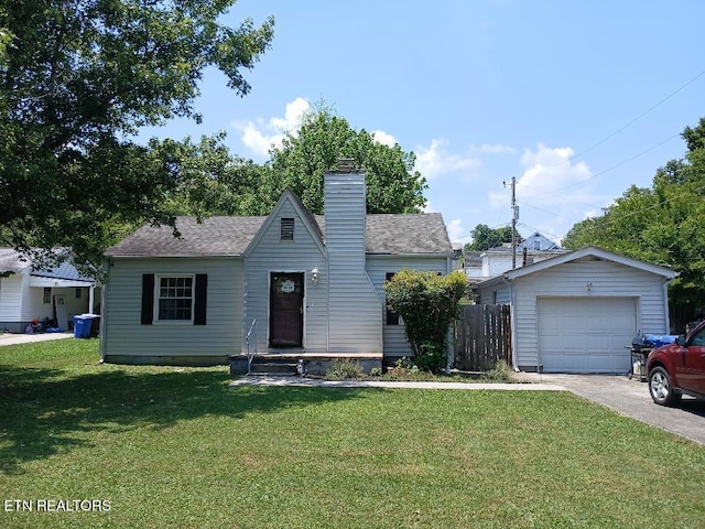 955 Poplar St, Alcoa, TN 37701 - view of front of home featuring a chimney, driveway, an outdoor structure, and roof with shingles