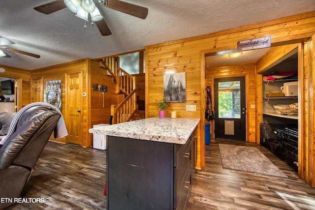 224 Eagle Blf, Jamestown, TN 38556 - kitchen featuring ceiling fan, wood walls, dark wood-style floors, a textured ceiling, and dark brown cabinets