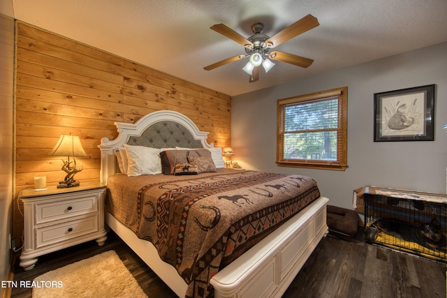 224 Eagle Blf, Jamestown, TN 38556 - bedroom with dark wood finished floors, wood walls, and ceiling fan